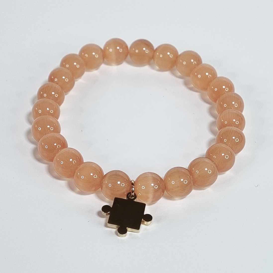 Amber Puzzle Handmade Cat Eye Stretch Bracelet with Gold-Plated Puzzle Charm