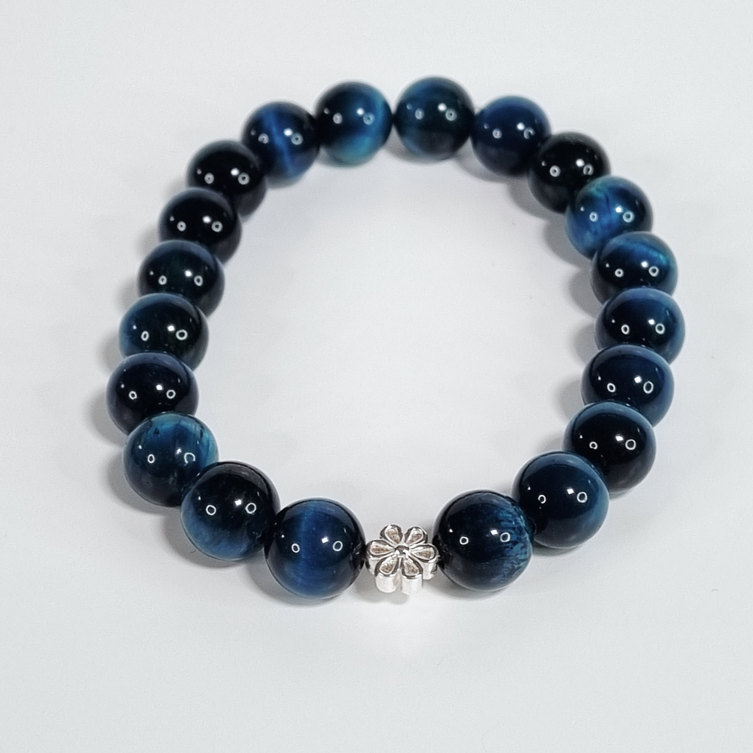 Evergreen Bloom Green-Blue Glass Bead Stretch Bracelet with Silver Flower Spacer