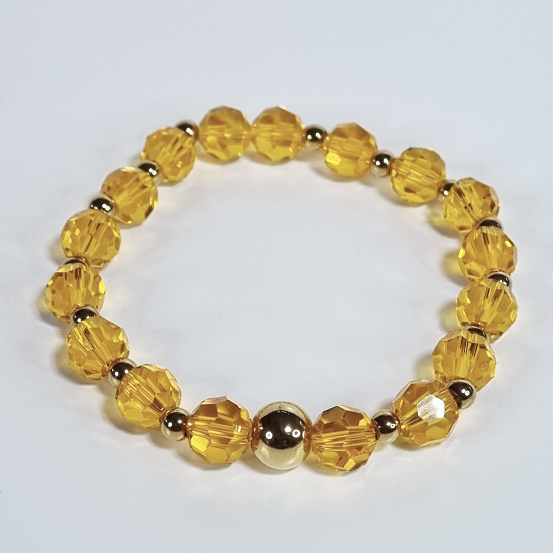 Orange Glass Stretch Bracelet with Gold Plated Spacers
