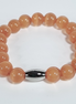 Sunstone Glow Orange Glass Bead Stretch Bracelet with Stainless Steel Oval Spacer