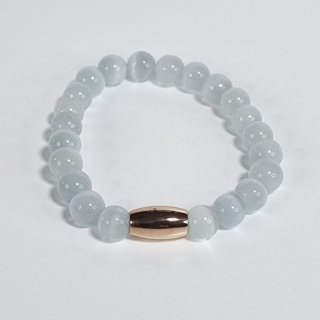 Zachte Roos Witte Glaskraal Stretch Armband met Roségouden Ovale Spacer